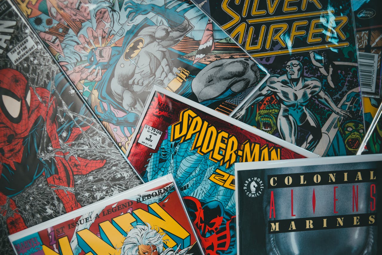 about-07 A vibrant assortment of iconic superhero comic books in a dynamic flat lay arrangement.