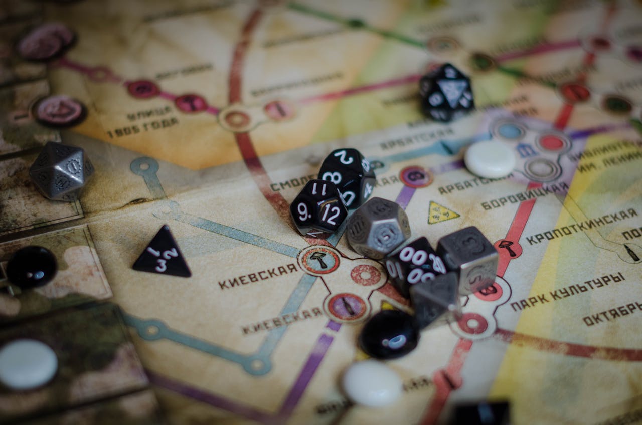 about-05 A vibrant board game scene featuring dice and a colorful map layout.